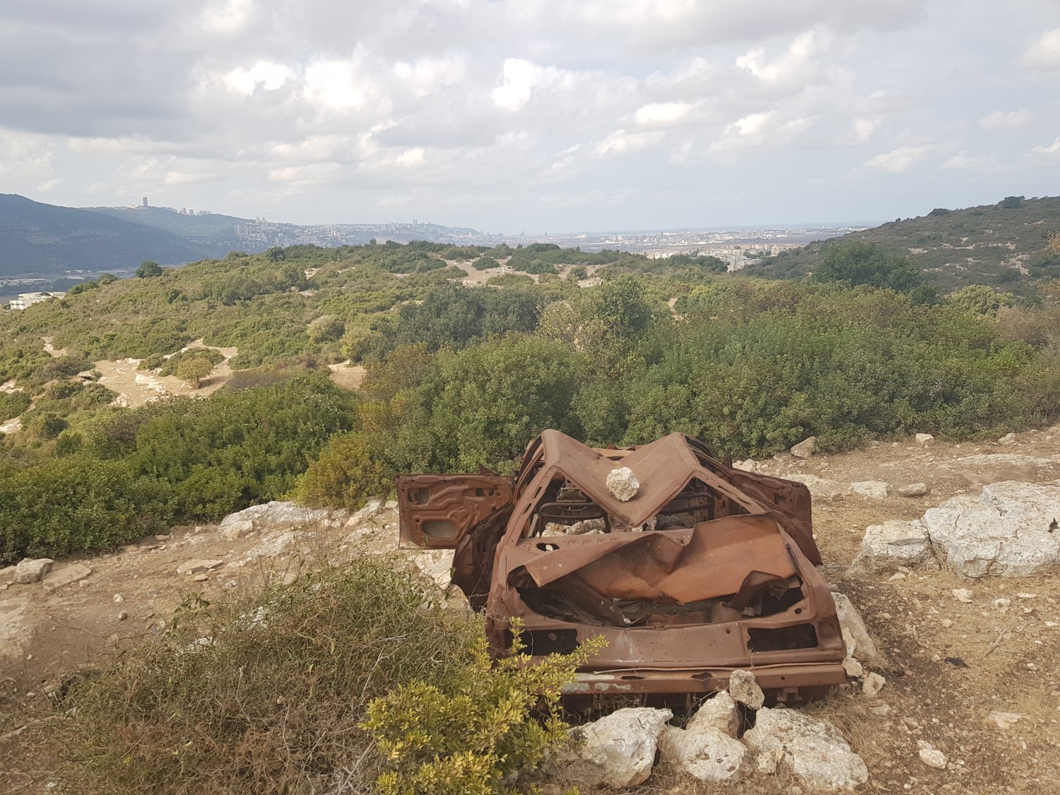 A crashed car in the middle of nowhere